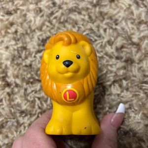 Fisher-Price Little People A-Z Learning Zoo playset. 
Letter L